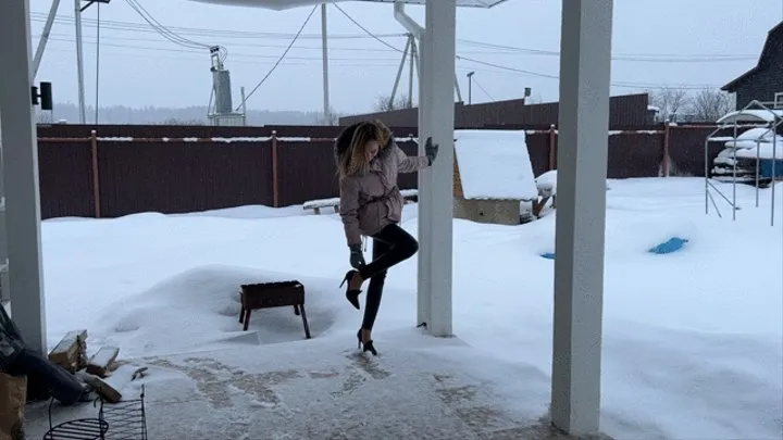 girl in high heels is glued to a cardboard box and can't get it off her shoes, she's annoyed by it