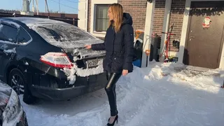 girl is in a hurry and tries to start the car, but something seems to be broken in it and it won't start at all