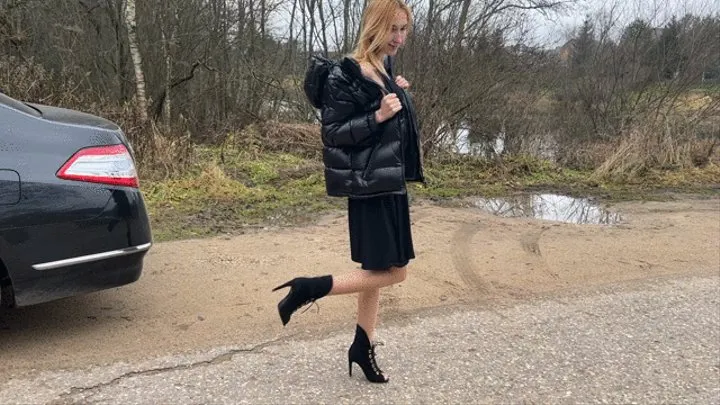 girl in high heel boots with open toes walks through the mud, gets her new boots and toes dirty