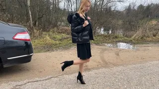 girl in high heel boots with open toes walks through the mud, gets her new boots and toes dirty