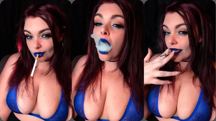 Smoking a cigarette in wearing a blue bikini top and blue lipstick