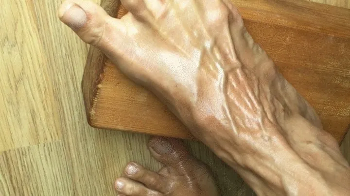 Veiny foot gripping a yoga block, veins pumped