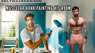 Muscular hunk painting his room