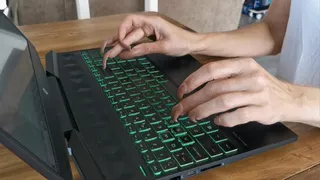 Long nails typing keyboard