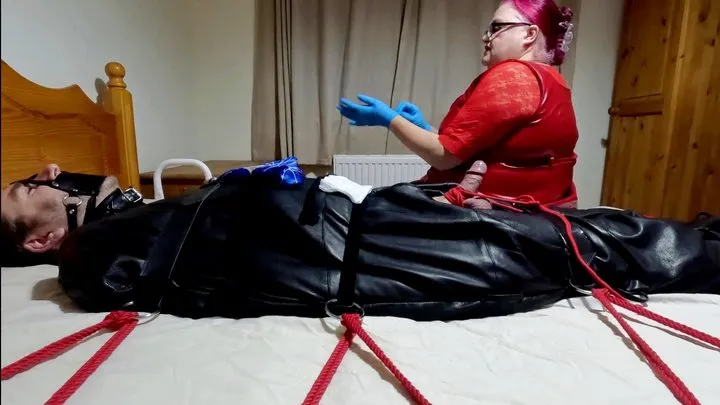 Miss M stockings and gauze cock polishing torment in leather sleepsack