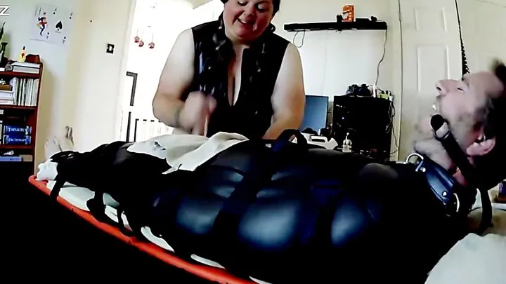 Miss K post orgasm torment on a helpless man bound in neoprene sack