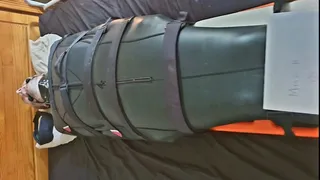 Miss M leaves helpless man bound in neoprene bondage sack