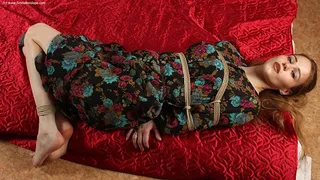 Anne: barefoot girl in flower dress, hogtied on the floor with hemp rope, wiggles and poses