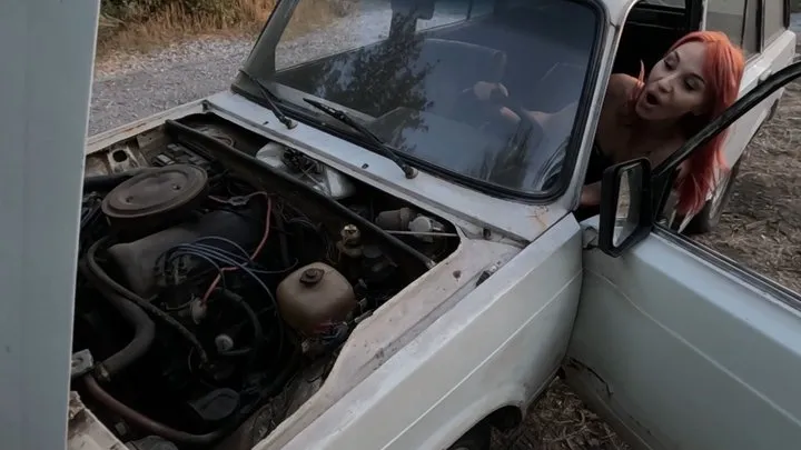 Anya is having a good time cranking the starter, she's never seen old wrecks like this before