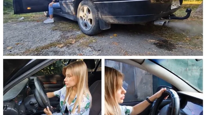 Young beautiful Lucy trying to start an old Opel from a cranked up Lanos