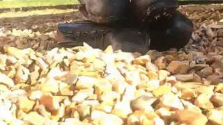 boots crushed with car in gravel