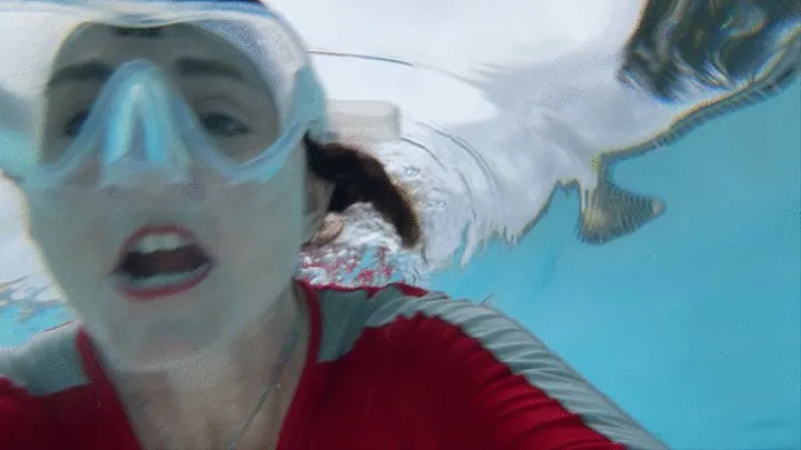 Carissa wearing the red and gray vintage diveskin in the public pool