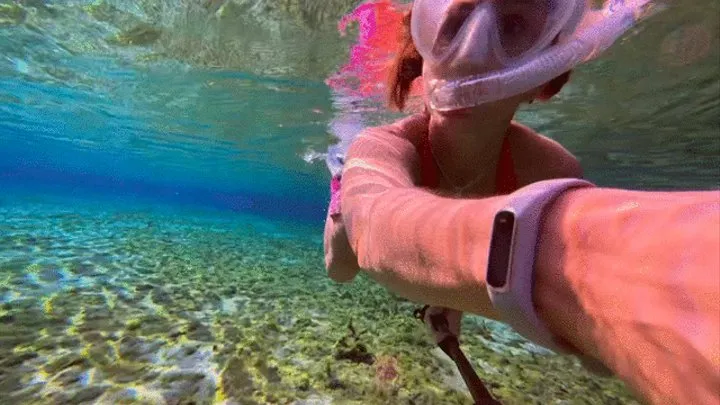 Carissa underwater freediving in the spring head--going deep!