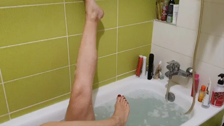 Amazon Eliza washing legs and feet in the tub