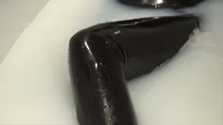 Asianrubberdoll takes a milk bath