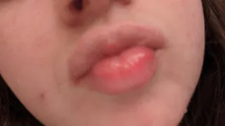 Showing off my mouth and tongue while I try on different kinds of lip gloss