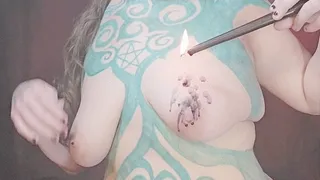 Goth girlfriend melts a black candle on her tit