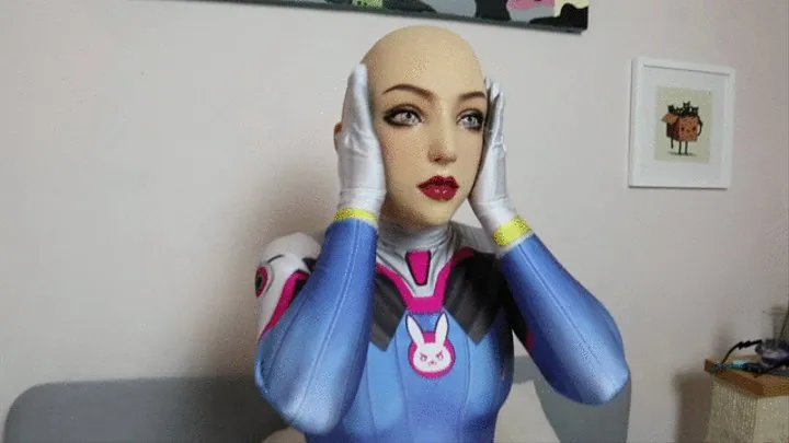 Silicone Doll in Dva Plugsuit Blindfolded, Gagged, with Tubes Inserted as Pussy Vibrated