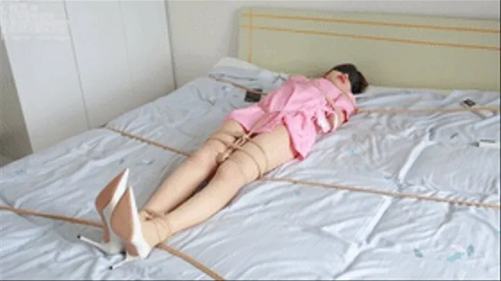 xy20 - very cute little nurse in stockings is tied and struggling on the bed