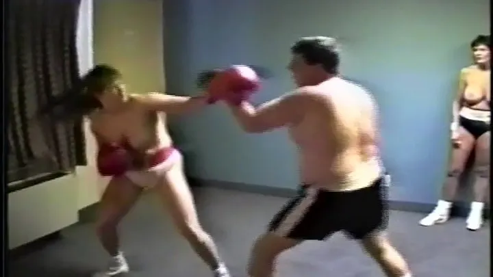 Tom's Birthday surprise continues with topless Nicki 40 DD in this mixed boxing match with great action