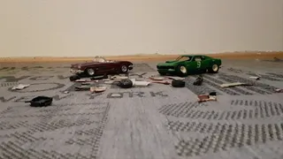 Two model cars crushed