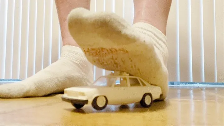 Socked feet crush car