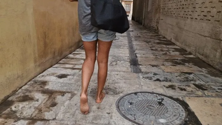 Barefoot walking through the old town