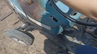 The Pedal Pumping Queen driving a vintage Tractor