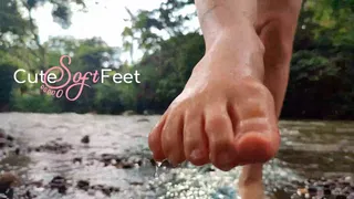 Playing with my feet and my legs in the river water second part