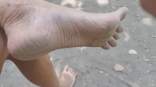 Dirty feet and flaccid dick, naked in public
