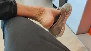 Heelpopping with my worn shoes in the waiting room