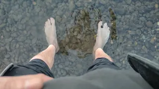 Tired and sweaty feet in the river waters