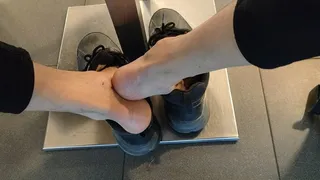 Shoeplay, dangling and dropping my sneakers at a public bar