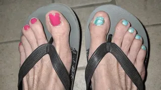 Night dangling with flip flops and painted toenails