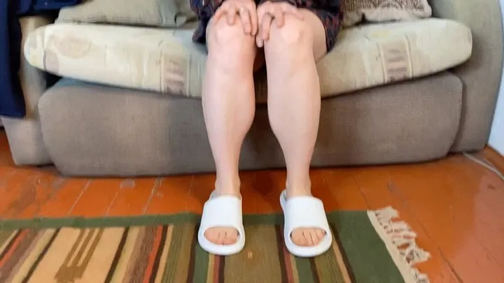 bare feet in white slippers