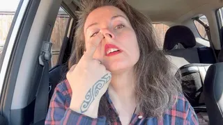 cleaning nose in the car