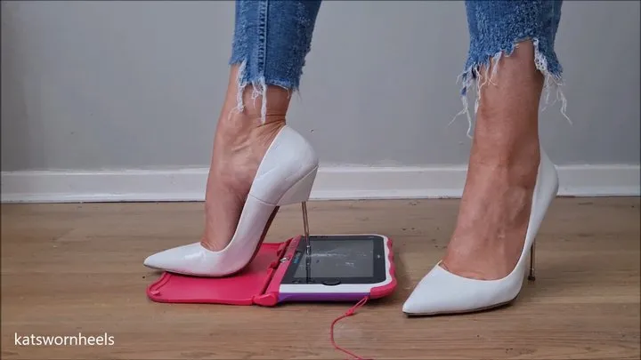 Kat Crushes a Tablet Under Her Sharp White Metal Stilettos