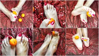 The feet are playing with a tangerine