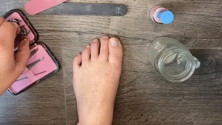 Pink pedicure on tough toenails