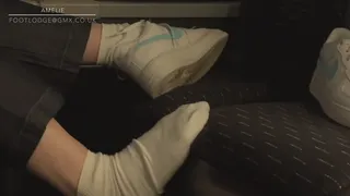 Amelie removes her Nike AF1 sneakers on the bus filmed candidly