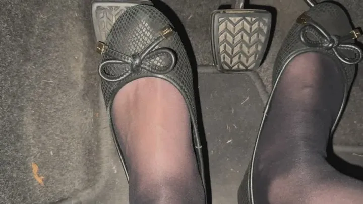 Pedal pumping in ballet flat shoes and black nylon tights