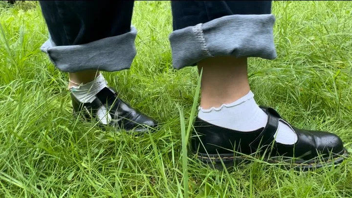 Naughty Amellie gets her feet and socks dirty while walking on the grass