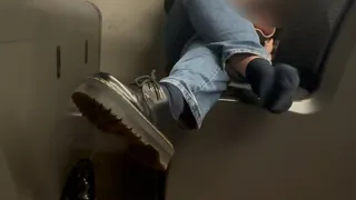 Candid shoeplay and shoe removal at night on bus