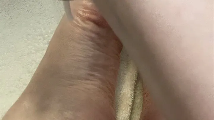 Rubbing Lotion on Feet