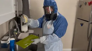 HAZMAT HOUSEWIFE CLEANS UP