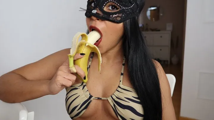 Big mouth licks and chews a banana in a bikini - Lalo Cortez