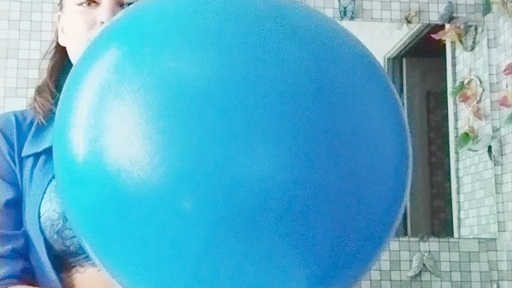 blowing giant blue balloon