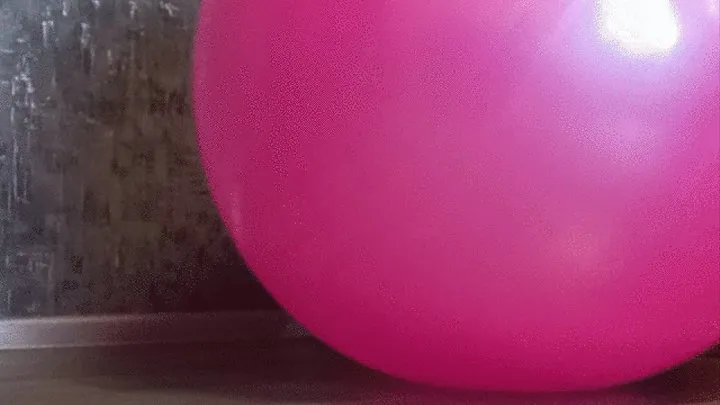 girl in jeans deflate pink gym ball