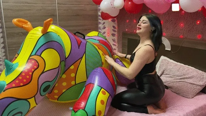 Sabina in latex leggings deflates a huge rhino on her bed!