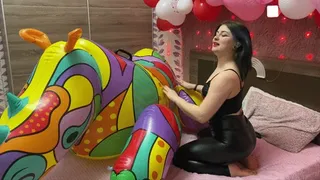 Sabina in latex leggings deflates a huge rhino on her bed!